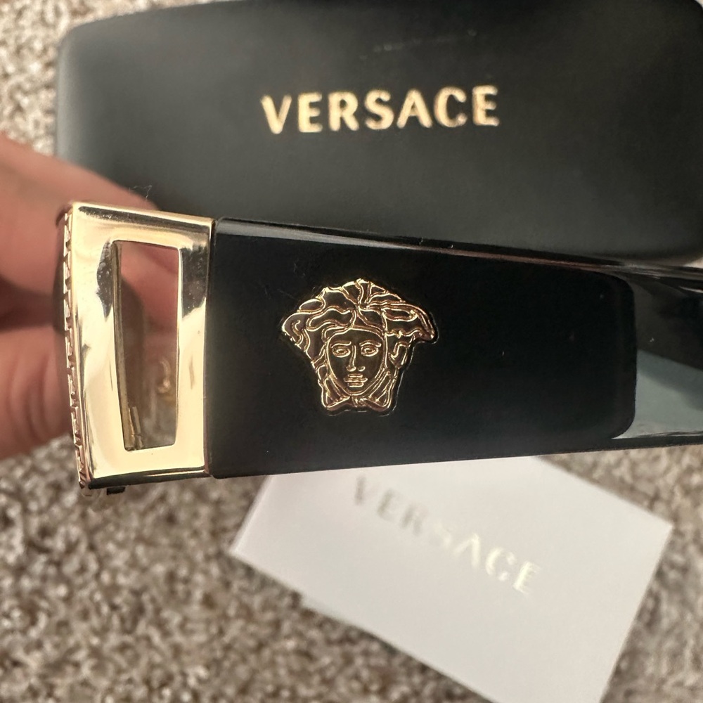 Versace Black and Gold Sunglasses with Iconic Design. Authentic